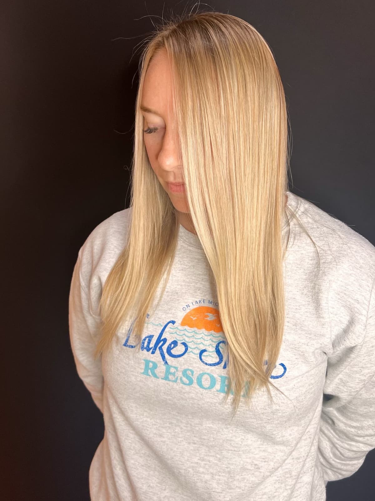 Smooth bright blonde hair colored by Courtney Morgan